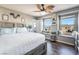 Bright bedroom features two window benches and a wooden accent wall at 589 Via Medici, Henderson, NV 89011