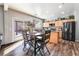 Modern kitchen featuring stainless steel appliances, center island, and adjacent dining area at 589 Via Medici, Henderson, NV 89011