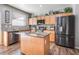 Well-equipped kitchen with stainless steel appliances, granite countertops, and hardwood floors at 589 Via Medici, Henderson, NV 89011
