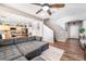 Open-concept living area with modern furnishings and seamless flow into the dining and kitchen at 589 Via Medici, Henderson, NV 89011