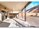 Covered patio with comfortable seating and a brick-paved courtyard at 589 Via Medici, Henderson, NV 89011