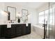 Sleek bathroom featuring a double vanity, soaking tub, and modern fixtures at 5904 Willowcreek Rd, North Las Vegas, NV 89031