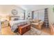 Comfortable bedroom featuring a cozy chair, soft carpet, and plenty of natural light at 6061 Leaping Foal St, North Las Vegas, NV 89081