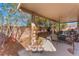 Backyard covered patio provides the ideal space for outdoor dining and relaxing at 6061 Leaping Foal St, North Las Vegas, NV 89081