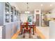 Dining area features a wooden table with seating for six, built-in cabinets, and natural light at 6061 Leaping Foal St, North Las Vegas, NV 89081