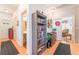 Hallway with bookcase leading to bathroom, bedroom and living room at 6061 Leaping Foal St, North Las Vegas, NV 89081