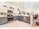 Well-lit open kitchen featuring stainless steel appliances and modern cabinetry at 6061 Leaping Foal St, North Las Vegas, NV 89081