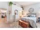 Spacious main bedroom featuring an ensuite bathroom, decorative accents, and natural light at 6061 Leaping Foal St, North Las Vegas, NV 89081