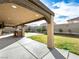 Spacious backyard with a covered patio, built-in barbecue, and landscaped features, perfect for outdoor entertaining at 6627 Bristle Canyon Ave, Las Vegas, NV 89110