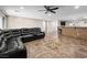 Open living area with tile flooring, adjacent to breakfast bar and kitchen, perfect for entertaining at 6627 Bristle Canyon Ave, Las Vegas, NV 89110