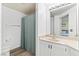Well-lit bathroom with a vanity, large mirror, and a shower with a curtain at 7115 S Durango Dr # 308, Las Vegas, NV 89113