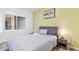 Comfortable bedroom featuring natural light from the window and a cozy gray bed at 7115 S Durango Dr # 308, Las Vegas, NV 89113