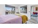 Bedroom featuring natural light from large windows and a comfortable bed with a view of the neighborhood at 7115 S Durango Dr # 308, Las Vegas, NV 89113
