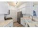 Bright kitchen with stainless steel appliances and pass through to living area at 7115 S Durango Dr # 308, Las Vegas, NV 89113