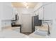 Kitchen featuring stainless steel appliances and white cabinetry at 7115 S Durango Dr # 308, Las Vegas, NV 89113