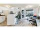 Bright living room with fireplace, bar seating, and sliding glass doors to a balcony at 7115 S Durango Dr # 308, Las Vegas, NV 89113