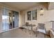 Private covered balcony with tile flooring, exterior light fixture, and unit number 313 at 7115 S Durango Dr # 313, Las Vegas, NV 89113