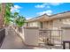 Charming exterior walkway with iron railings and beautifully maintained landscaping at 7115 S Durango Dr # 313, Las Vegas, NV 89113