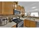 Modern kitchen featuring stainless steel appliances, light countertops and ample storage at 7115 S Durango Dr # 313, Las Vegas, NV 89113
