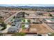 A beautiful home and property that includes a pool, a putting green, and a large dirt lot at 723 Spanish Dr, Las Vegas, NV 89110