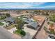 Expansive home with a large yard featuring a pool, putting green, and ample space at 723 Spanish Dr, Las Vegas, NV 89110