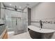 Modern bathroom featuring sleek black tub, walk-in shower, and contemporary tiling at 723 Spanish Dr, Las Vegas, NV 89110