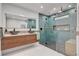 Spa-like bathroom featuring double vessel sinks, stylish vanity, and a large shower with a built-in bench at 723 Spanish Dr, Las Vegas, NV 89110