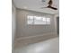 Bright bedroom space with tile floors, offering ample natural light and neutral decor at 723 Spanish Dr, Las Vegas, NV 89110