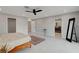 Airy bedroom featuring recessed lighting, bright white walls, tile flooring, and access to an ensuite bathroom at 723 Spanish Dr, Las Vegas, NV 89110