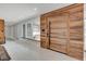Bright foyer with a modern wood door, white tile flooring, and contemporary finishes at 723 Spanish Dr, Las Vegas, NV 89110