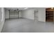 Large garage with bright lighting, storage room, and epoxy flooring, perfect for car enthusiasts at 723 Spanish Dr, Las Vegas, NV 89110
