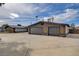 View of the home's exterior featuring a spacious driveway and a two-car garage at 723 Spanish Dr, Las Vegas, NV 89110