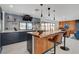 Bright kitchen with a large island and dark wood cabinets at 723 Spanish Dr, Las Vegas, NV 89110