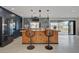 Charming kitchen with dark wood cabinets and a large island with seating at 723 Spanish Dr, Las Vegas, NV 89110