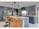 Charming kitchen with dark wood cabinets, an island and stainless appliances at 723 Spanish Dr, Las Vegas, NV 89110