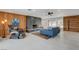 Large living room features a fireplace, modern tile floor, and contemporary furnishings at 723 Spanish Dr, Las Vegas, NV 89110