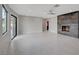 Bright living room features a modern fireplace and sliding doors to the backyard at 723 Spanish Dr, Las Vegas, NV 89110