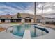 Inviting backyard pool features an updated deck, diving board, and views of the nearby mountains at 723 Spanish Dr, Las Vegas, NV 89110