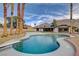 Inviting backyard pool features an updated deck, diving board, and views of the nearby mountains at 723 Spanish Dr, Las Vegas, NV 89110