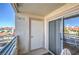 A relaxing balcony features a glass sliding door, storage closet and a neighborhood view at 7909 Fossil Creek Ln # 202, Las Vegas, NV 89145