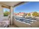 This cozy balcony with a table offers beautiful views of the neighborhood and covered parking at 7909 Fossil Creek Ln # 202, Las Vegas, NV 89145