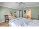 Light and airy bedroom with wood-look floors and light green walls, featuring a full bath nearby at 7909 Fossil Creek Ln # 202, Las Vegas, NV 89145