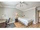 Serene bedroom with a desk area and wood-look flooring, perfect for work and rest at 7909 Fossil Creek Ln # 202, Las Vegas, NV 89145