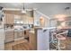 Well-equipped kitchen with breakfast bar and modern appliances, perfect for casual dining and entertaining at 7909 Fossil Creek Ln # 202, Las Vegas, NV 89145