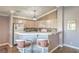 Open-concept kitchen features a breakfast bar, modern appliances, and ample cabinet space for efficient meal prep at 7909 Fossil Creek Ln # 202, Las Vegas, NV 89145