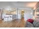 Bright living room featuring an open layout with hardwood floors and a breakfast bar overlooking the kitchen at 7909 Fossil Creek Ln # 202, Las Vegas, NV 89145