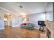 Bright and airy living room with laminate flooring, seamlessly connects to the entrance, kitchen, and dining areas at 7909 Fossil Creek Ln # 202, Las Vegas, NV 89145