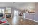 Spacious living room featuring a fireplace, breakfast bar seating, and access to a balcony at 7909 Fossil Creek Ln # 202, Las Vegas, NV 89145