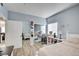 Bright bedroom featuring a sliding mirror closet, light blue walls, and wood-look flooring at 833 Aspen Peak Loop # 712, Henderson, NV 89011