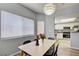 Inviting dining space with contemporary decor, natural light, and an open view to the modern kitchen at 833 Aspen Peak Loop # 712, Henderson, NV 89011